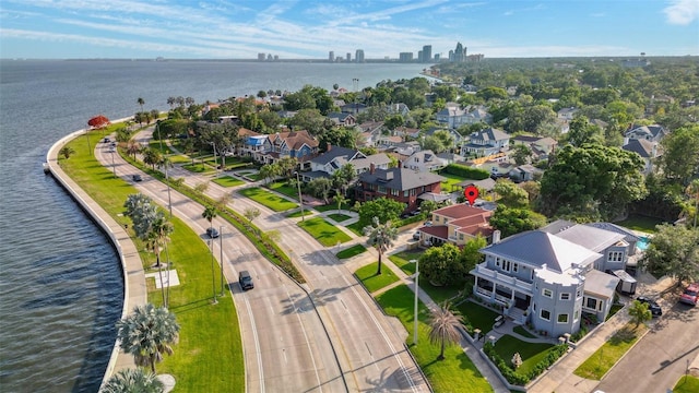 bird's eye view featuring a water view and a residential view