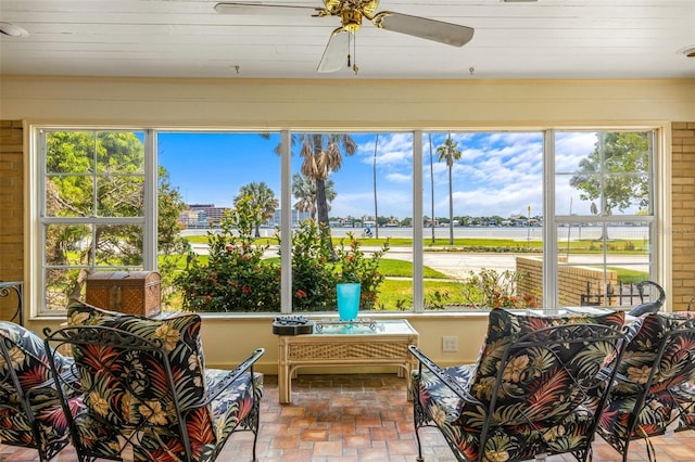 sunroom / solarium with a wealth of natural light and ceiling fan