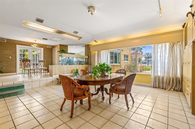 tiled dining room with rail lighting