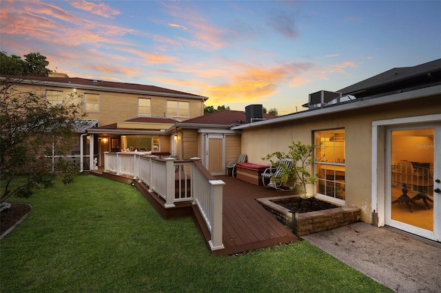 deck at dusk with a yard