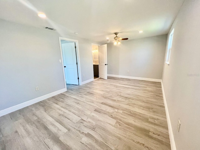 unfurnished room with light hardwood / wood-style floors and ceiling fan