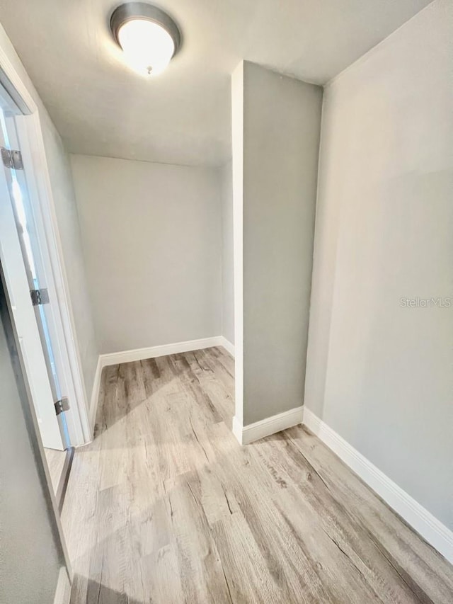 spare room featuring light wood-type flooring