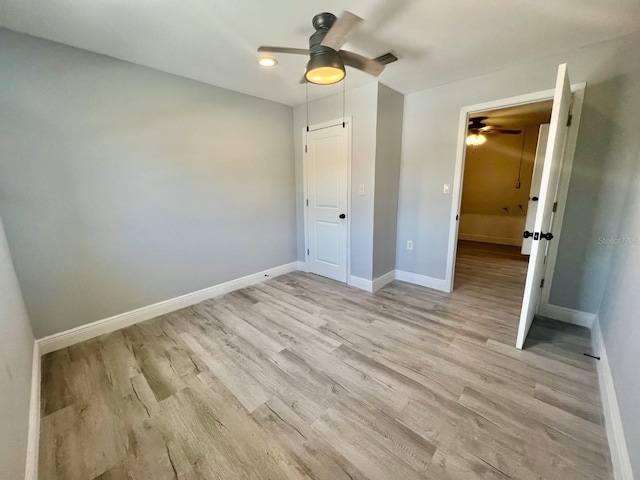 unfurnished bedroom featuring ceiling fan and light hardwood / wood-style floors