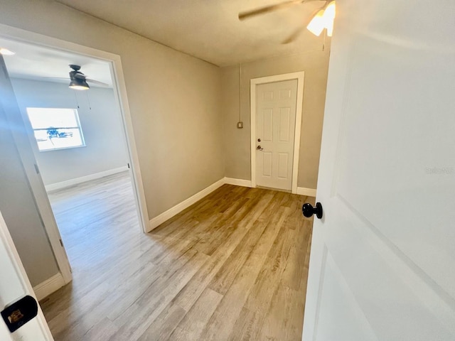 interior space with ceiling fan and light hardwood / wood-style floors