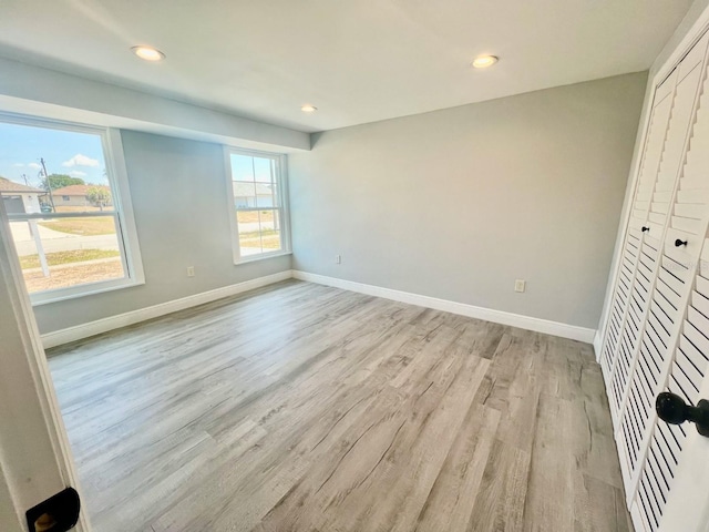 unfurnished bedroom with light hardwood / wood-style floors