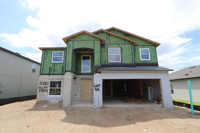 property in mid-construction with a garage