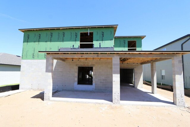 rear view of house featuring a patio