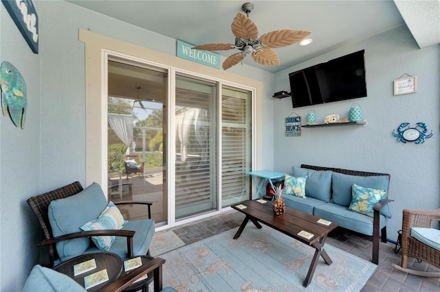 view of patio featuring ceiling fan and an outdoor living space