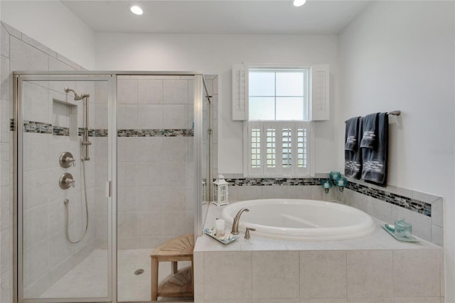 bathroom with separate shower and tub