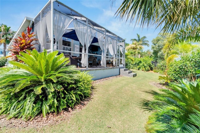 view of yard featuring glass enclosure