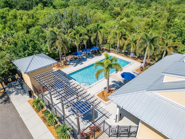 view of pool with a pergola and a patio area