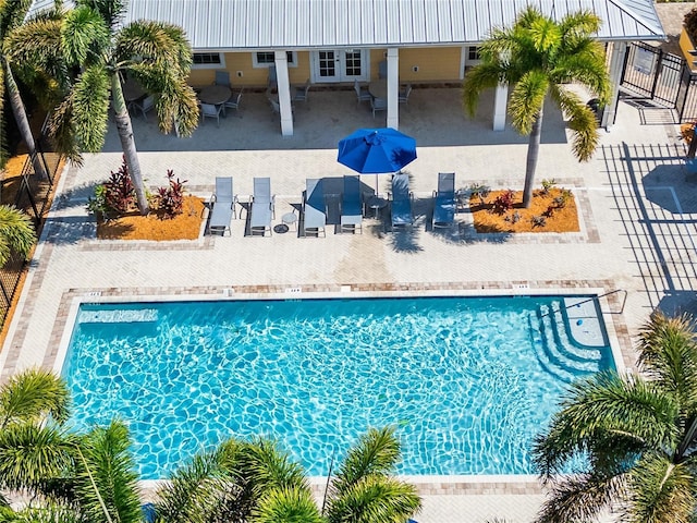 view of swimming pool featuring a patio area