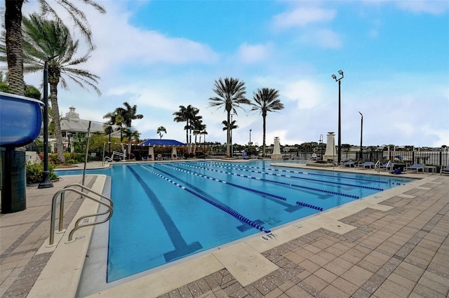 view of swimming pool featuring a patio area