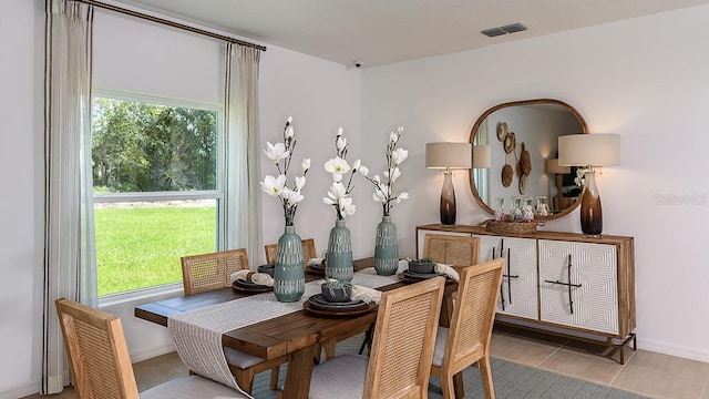 tiled dining area with a healthy amount of sunlight