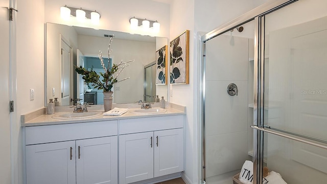 bathroom with vanity and walk in shower