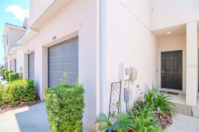 property entrance with a garage