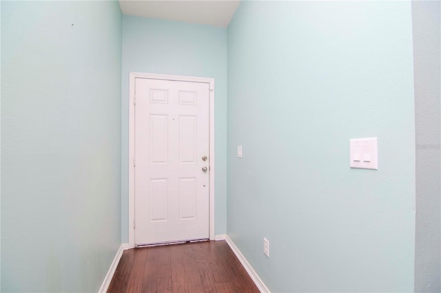 doorway to outside with wood-type flooring