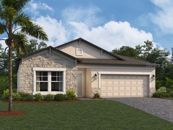 view of front of house featuring a garage and a front yard