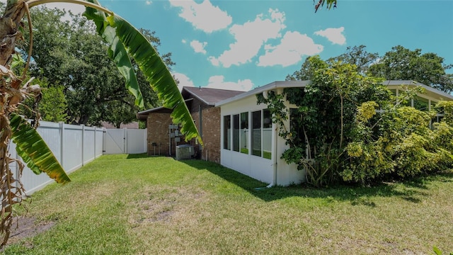 view of yard with a sunroom