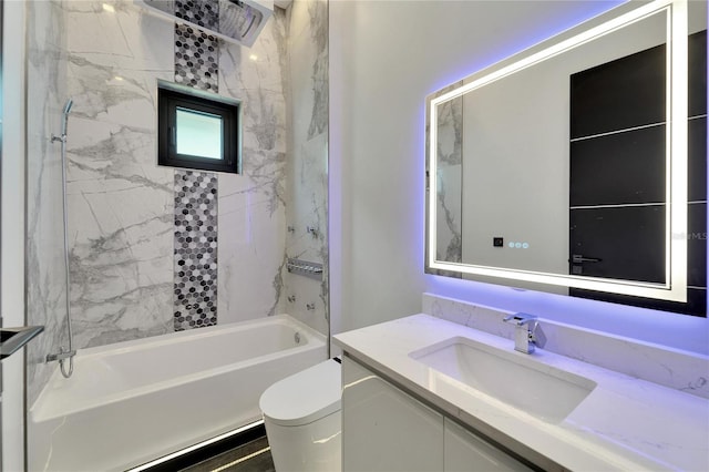 full bathroom with vanity, toilet, and tiled shower / bath combo