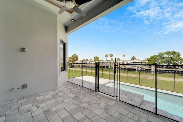 view of patio / terrace featuring ceiling fan