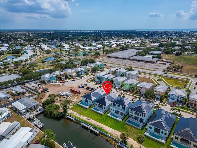 drone / aerial view with a water view