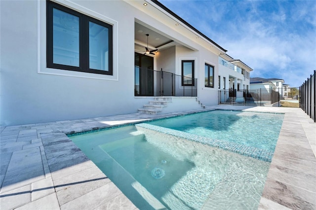 view of swimming pool featuring a fenced in pool, fence, ceiling fan, and a patio