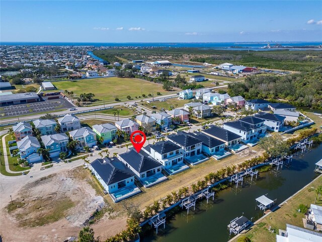 bird's eye view with a water view and a residential view