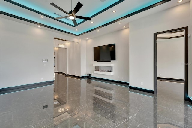 spare room with marble finish floor, recessed lighting, a ceiling fan, and baseboards