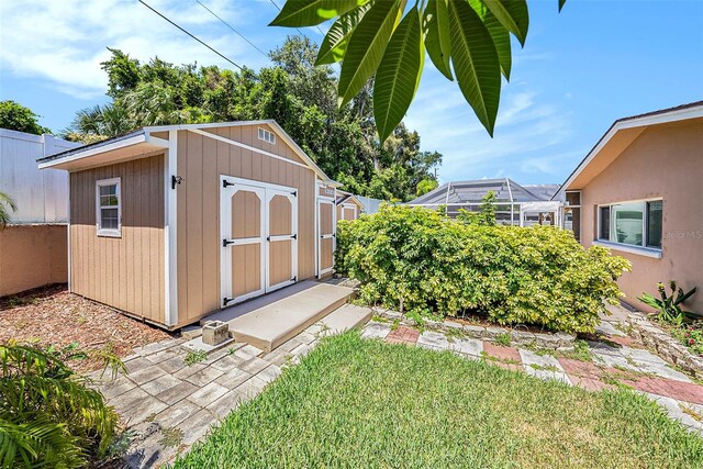 view of outbuilding featuring a lawn