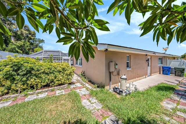 view of home's exterior with a lanai