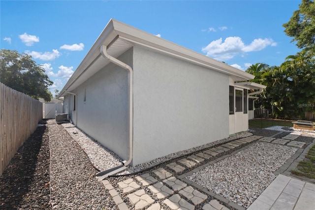 view of property exterior with cooling unit