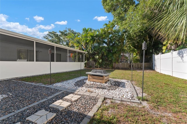 view of yard with a sunroom