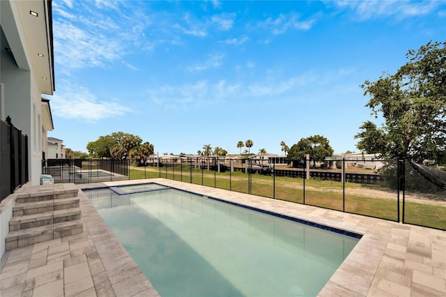 view of pool featuring a lawn