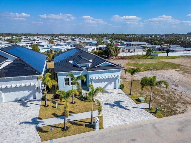 6542 Simone Shores Cir, Apollo Beach, FL 33572 - view of front of home featuring an attached garage, decorative driveway, a residential view, and stucco siding