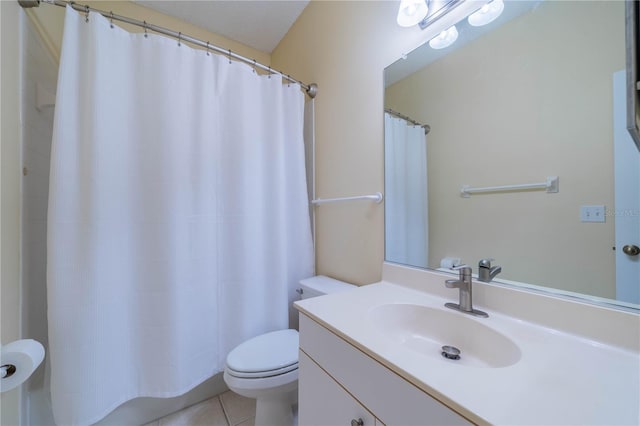 full bath featuring vanity, tile patterned flooring, and toilet