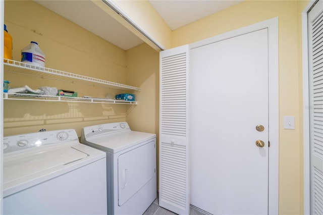 laundry room with laundry area and washer and clothes dryer