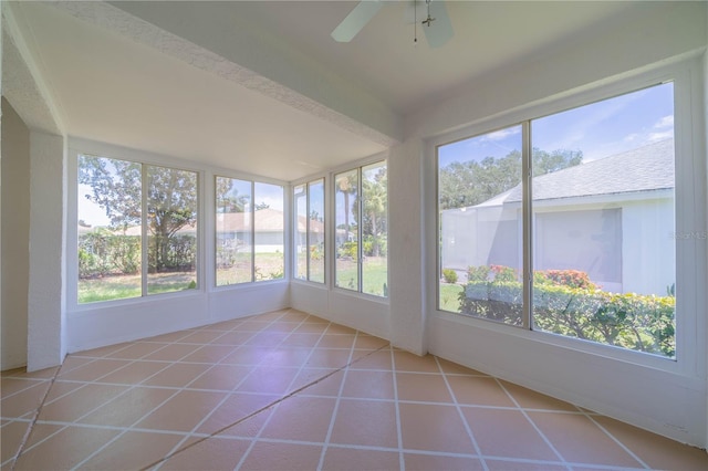 unfurnished sunroom with plenty of natural light and ceiling fan