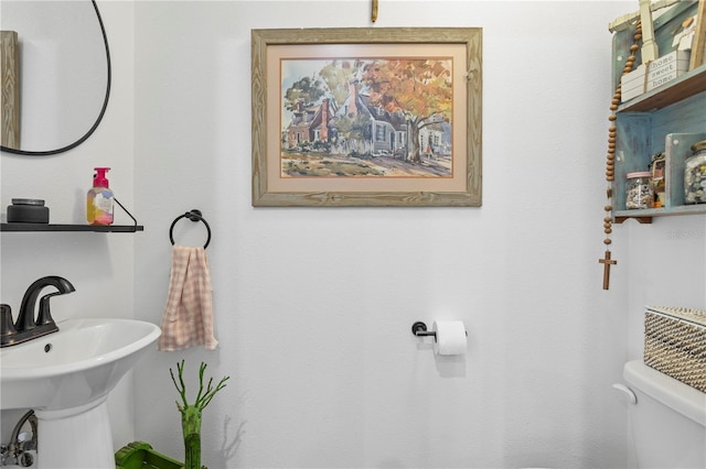 bathroom featuring sink and toilet