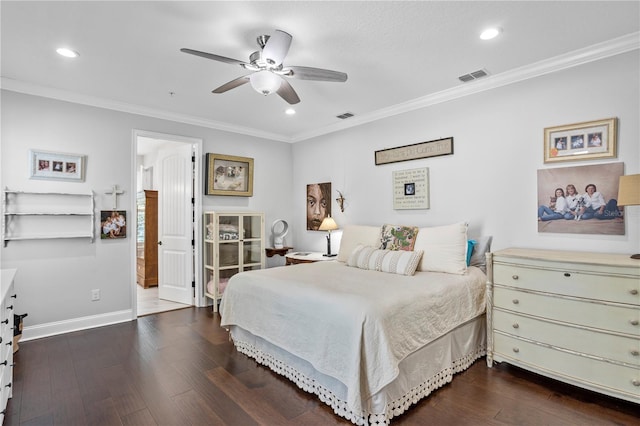 bedroom featuring ceiling fan, crown molding, and dark hardwood / wood-style floors