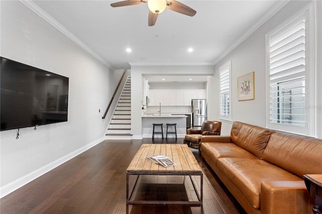 living room with crown molding, dark wood finished floors, recessed lighting, stairway, and baseboards