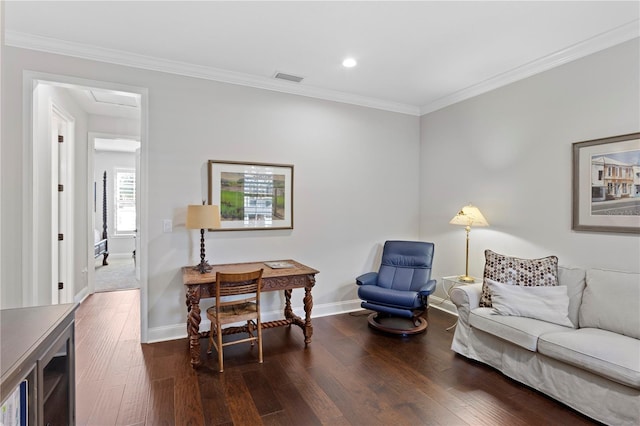 interior space with baseboards, dark wood-type flooring, visible vents, and crown molding