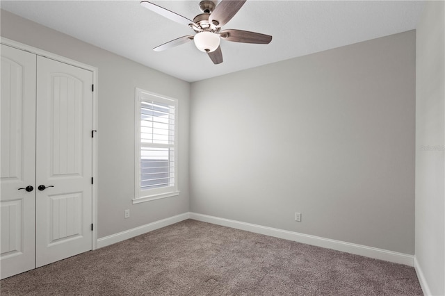 4606 W Fig St Unit 4, Tampa, FL 33609 - unfurnished bedroom with carpet, a closet, baseboards, and a ceiling fan