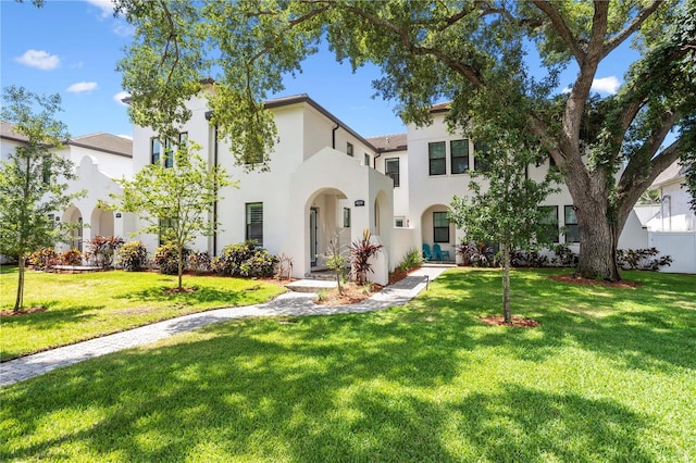 4606 W Fig St Unit 4, Tampa, FL 33609 - mediterranean / spanish house featuring stucco siding and a front yard