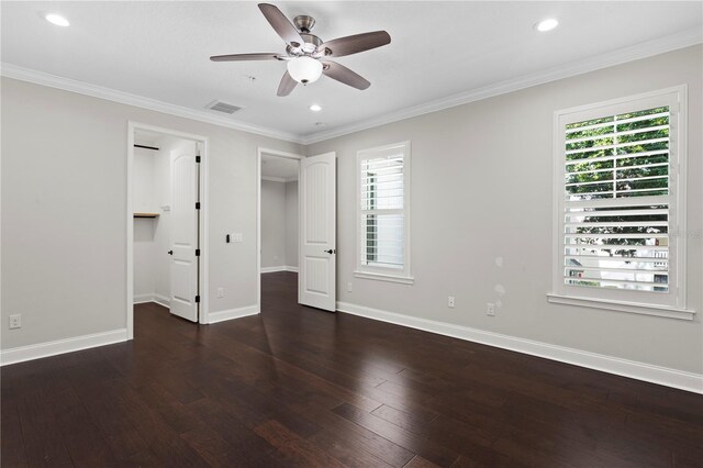 4606 W Fig St Unit 4, Tampa, FL 33609 - unfurnished bedroom with hardwood / wood-style flooring, baseboards, recessed lighting, ornamental molding, and a walk in closet