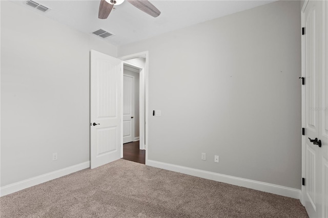 4606 W Fig St Unit 4, Tampa, FL 33609 - unfurnished bedroom featuring dark colored carpet, baseboards, a ceiling fan, and a closet