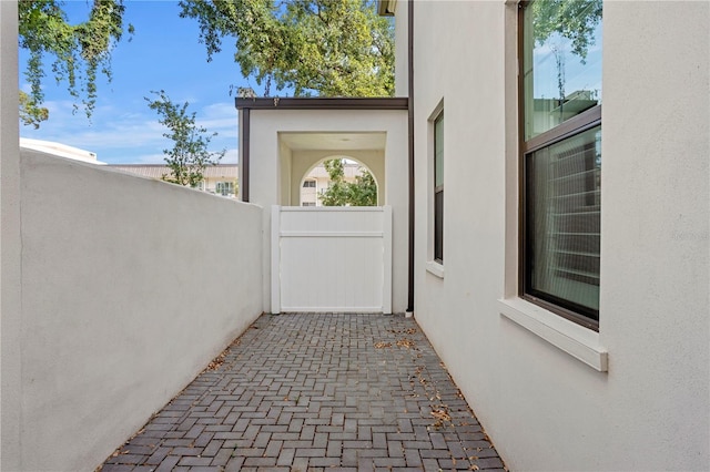 4606 W Fig St Unit 4, Tampa, FL 33609 - doorway to property with stucco siding and fence