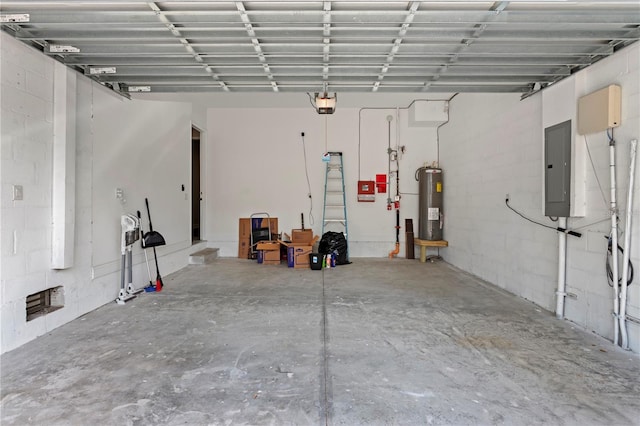 4606 W Fig St Unit 4, Tampa, FL 33609 - garage featuring electric panel, water heater, and a garage door opener