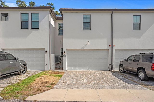 4606 W Fig St Unit 4, Tampa, FL 33609 - multi unit property with an attached garage, stucco siding, and decorative driveway