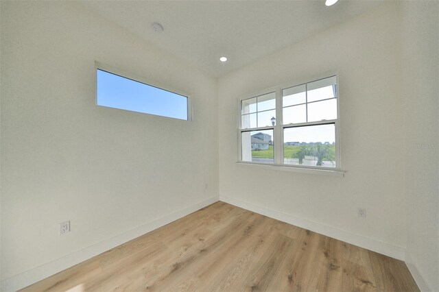 unfurnished room featuring light hardwood / wood-style flooring